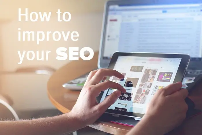 Woman working on a laptop - How to improve your SEO